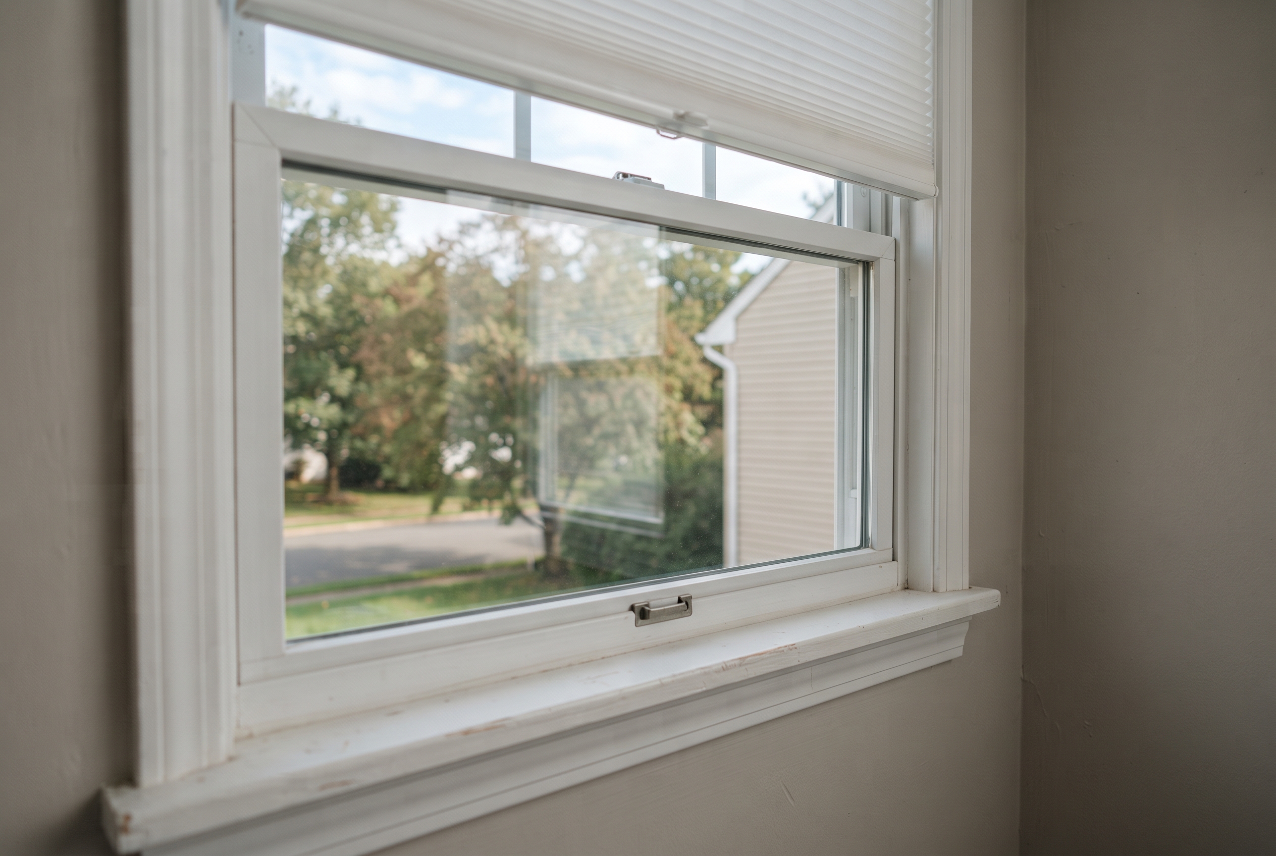 Close-up of a clean window frame and sill on a South Jersey home